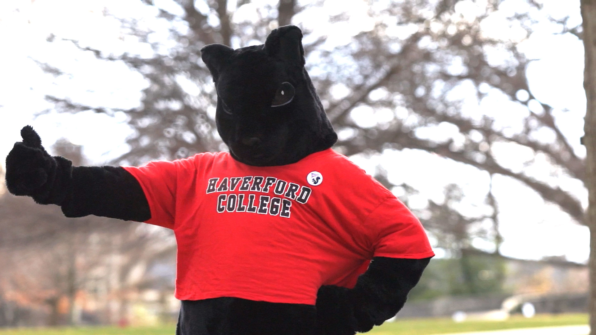 the black squirrel mascot giving a thumbs-up