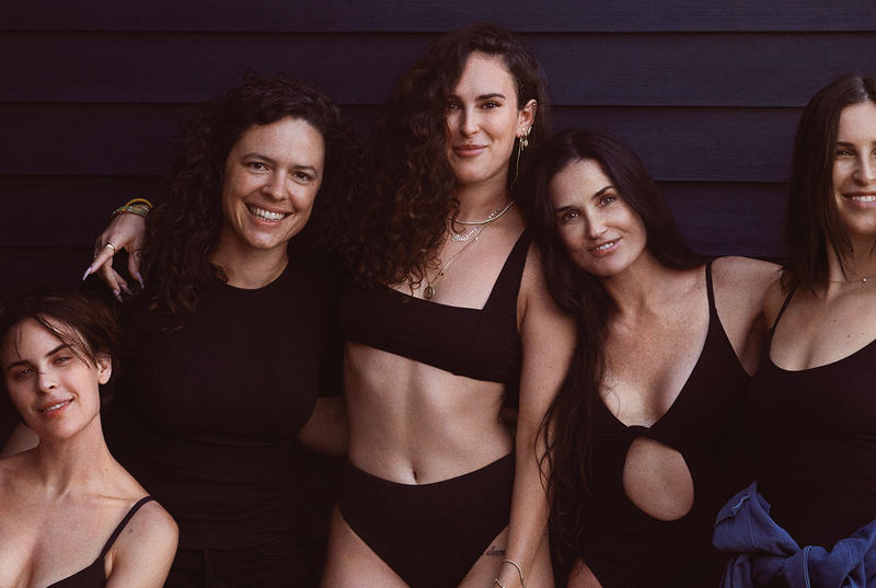 Five women posing for an advetising campaign for swimsuits
