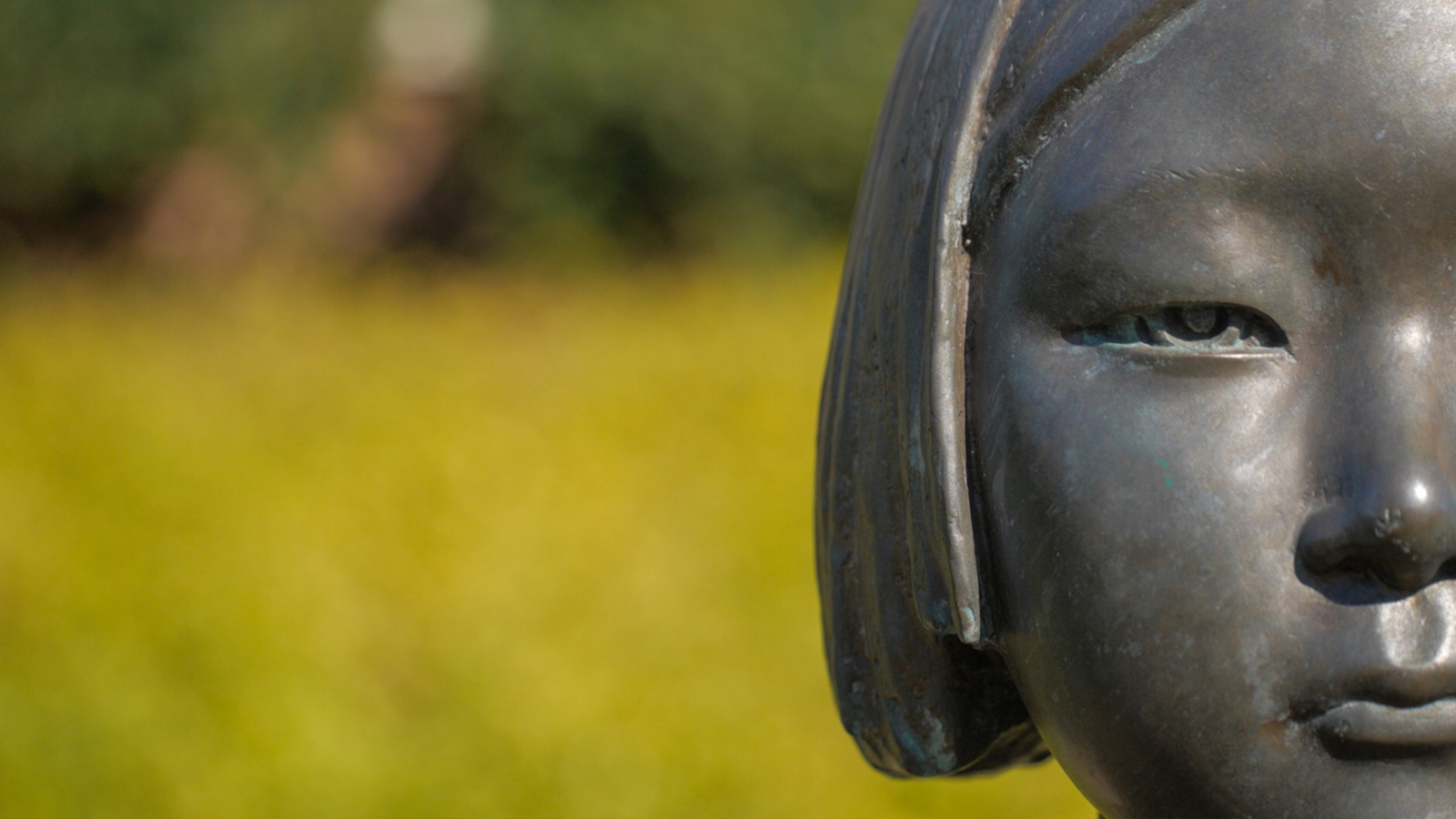 close-up of the face of a statue of a japanese girl