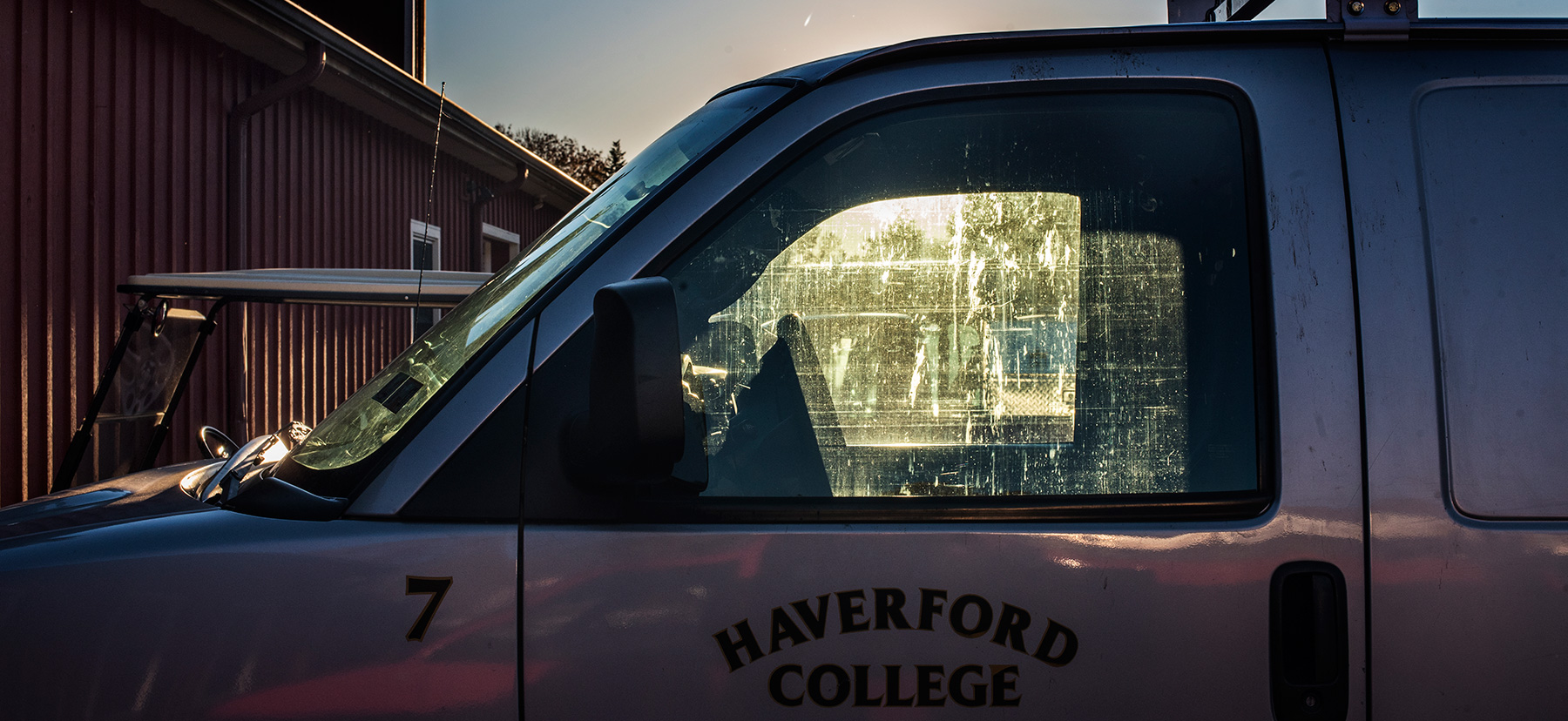 Photo of a Haverford College truck at sunset