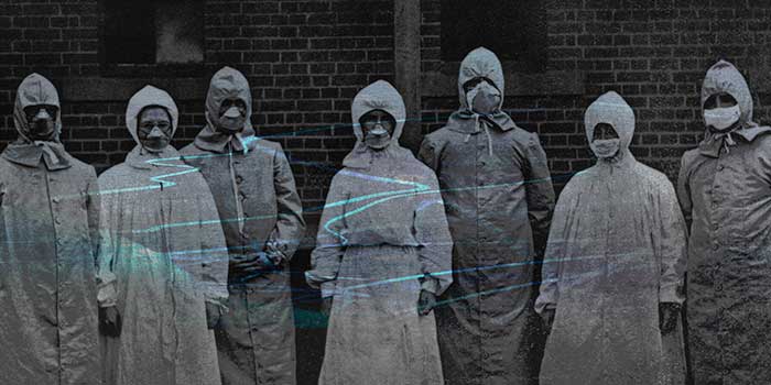 grainy, unsettling archival photo of people wearing protective suits during the Spanish flu pandemic