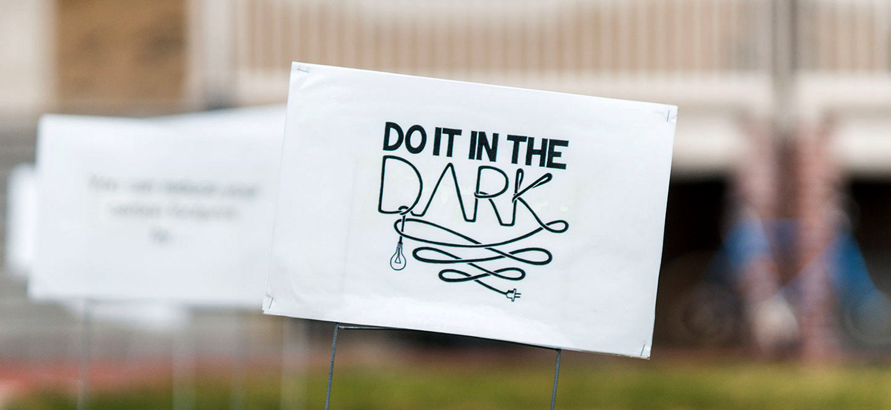 A Do it in the Dark sign