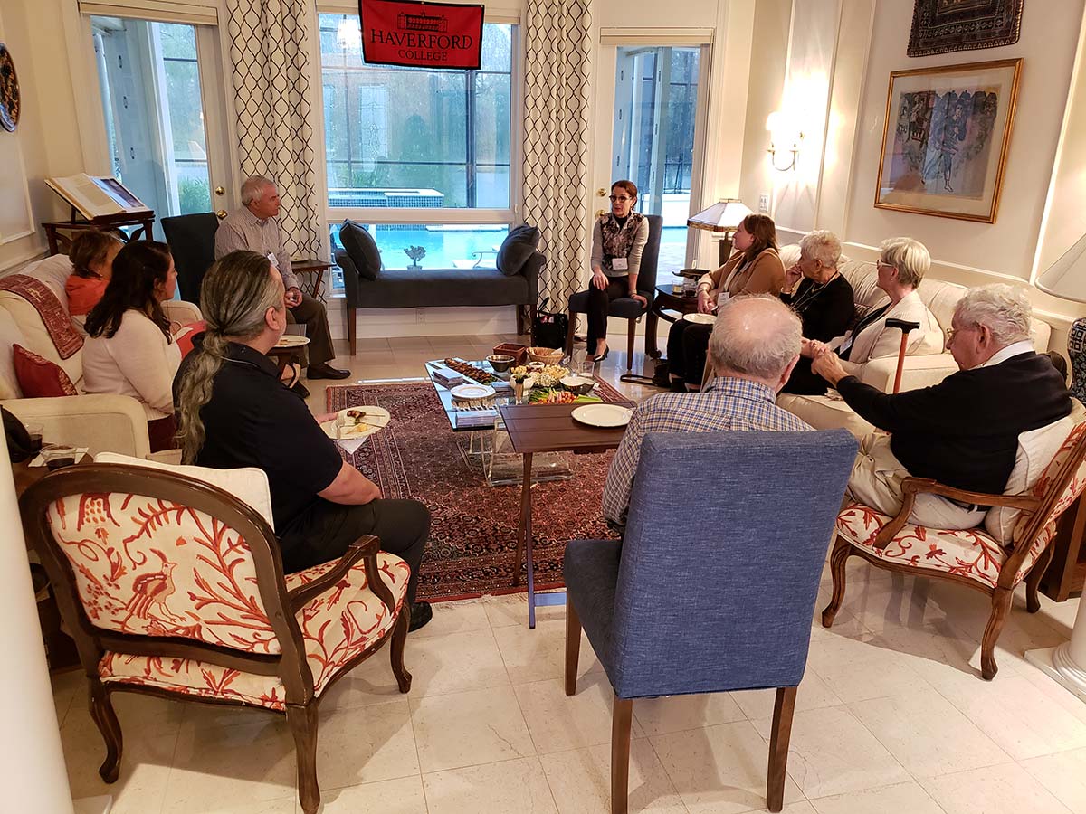 scarlet sages gathered together in a living room