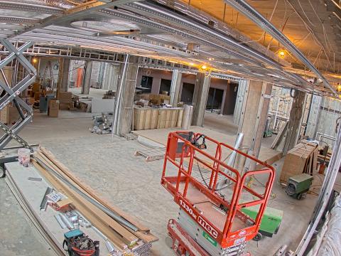 interior of the library under construction, featuring an extended cherry picker.