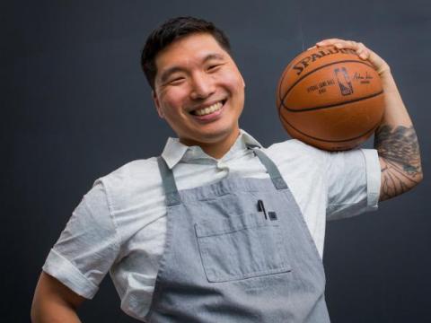 Smiling man holding a basketball