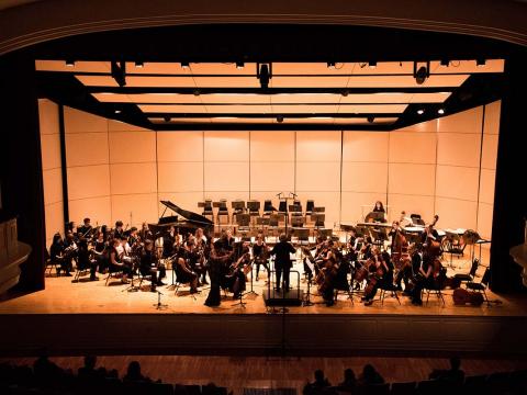 bi-college orchestra performing