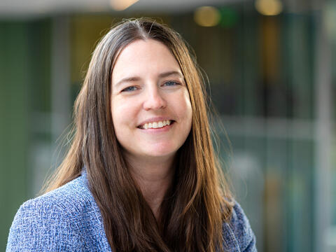 Melissa Shaffmaster is pictured in a portrait against an out of focus background. 