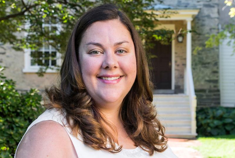 Kristen Whalen smiles outside of Founders Hall