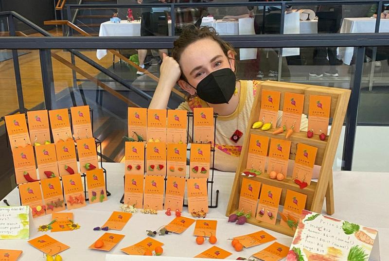 Student at art festival with earrings