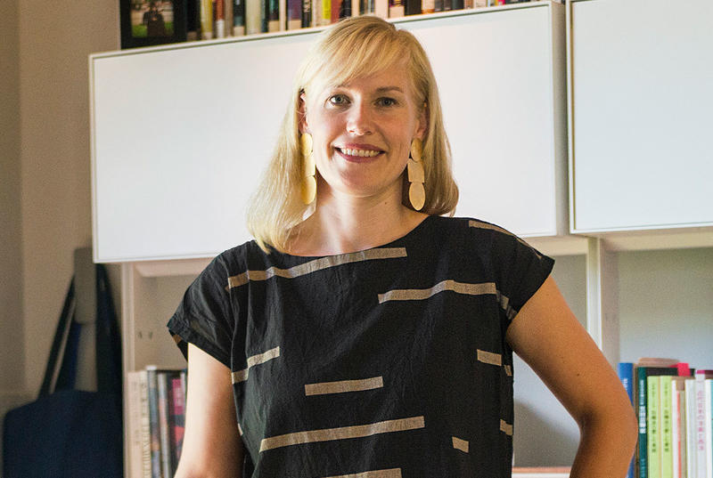 Professor Erin Schoneveld wears a black shirt in a portrait taken in her office on Haverford's campus. 