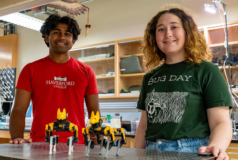 Deep and Willow stand in their lab in the KINSC. They are pictured with their robot dogs, Anubis and Horus.