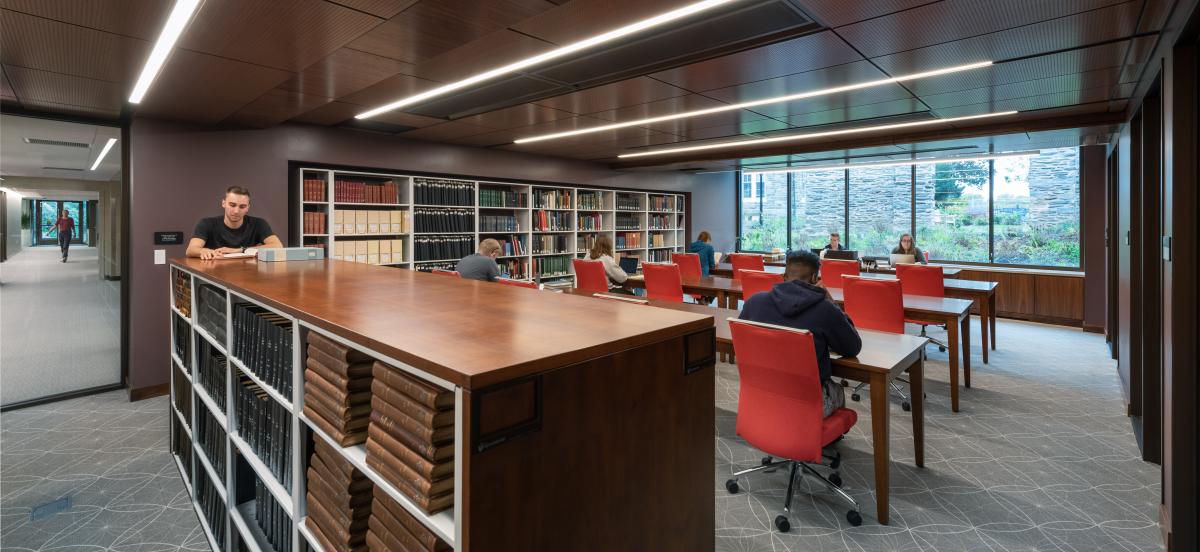 photo of the Quaker & Special Collections reading room, where several people are looking at materials and working